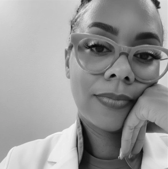 Professor Simpson, founder of CliniQ Learning, wearing glasses and a white coat